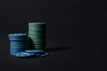 Poker chips on dark background