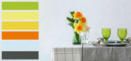 Beautiful table setting with narcissus flowers. Different color samples