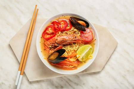 Bowl of tasty Thai soup on white backgroundの写真素材