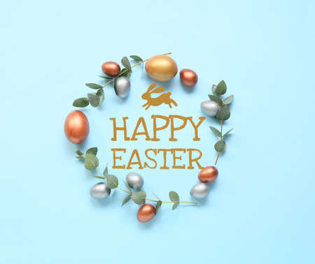 Frame made of painted eggs and text HAPPY EASTER on blue backgroundの写真素材