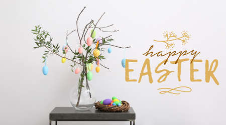 Creative greeting card for Easter celebration with eggs hanging on tree branches