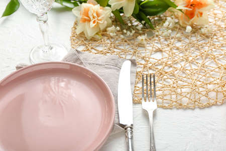 Beautiful table setting on white backgroundの写真素材