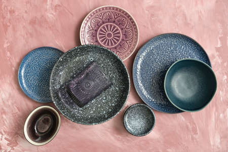 Stylish clean tableware on color backgroundの写真素材