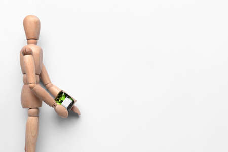 Wooden mannequin with box on white background. Concept of dismissalの写真素材