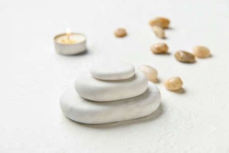 Spa stones on white background