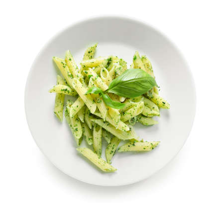 Plate with tasty pesto pasta on white backgroundの写真素材