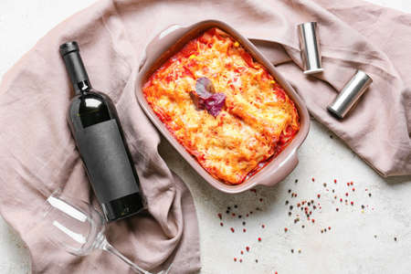 Composition with tasty tomato lasagna on light backgroundの写真素材