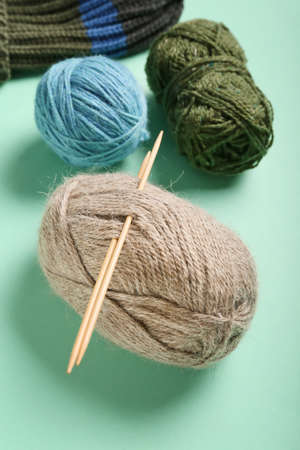 Yarn and knitting needles on color background, closeupの写真素材