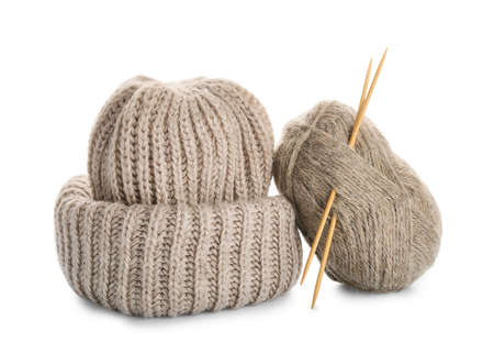 Yarn with knitting needles and hat on white backgroundの写真素材
