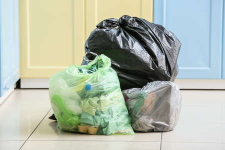 Bags with different garbage at home