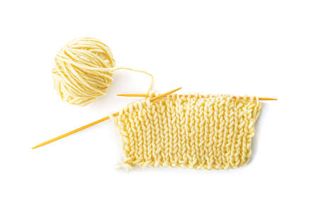 Knitting yarn and needles on white background