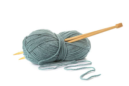 Knitting yarn and needles on white background
