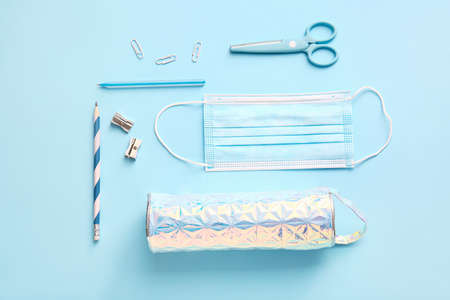 Pencil case with stationery on color backgroundの写真素材