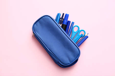 Pencil case with stationery on color backgroundの写真素材