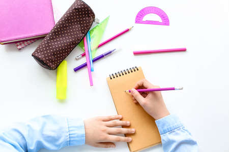 Little girl studying at table, top viewの写真素材