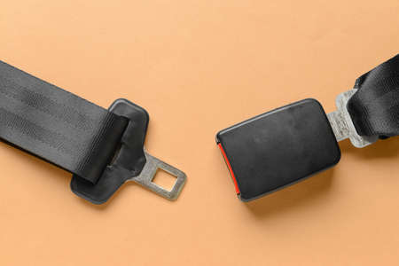 Car seat belt on color background