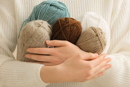 Woman with knitting yarn, closeup