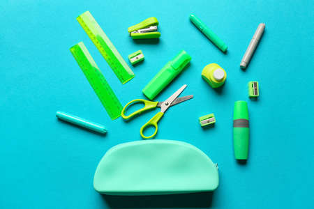 Stylish pencil case and stationery on blue backgroundの写真素材