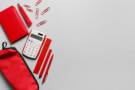 Pencil case with stationery and calculator on light backgroundの写真素材