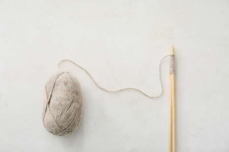 Knitting yarn and needles on light backgroundの写真素材