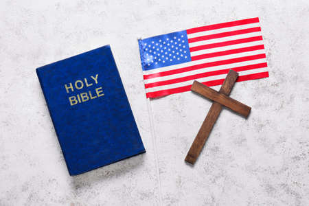 Holy Bible with flag of USA and cross on white backgroundの写真素材