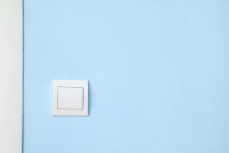 Modern switch on blue wallの写真素材