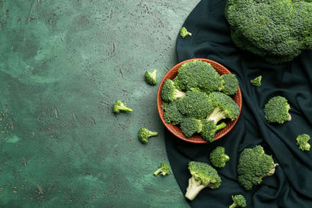 Plate with healthy broccoli cabbage on color backgroundの写真素材