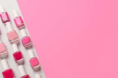 Bottles of nail polishes on color backgroundの写真素材