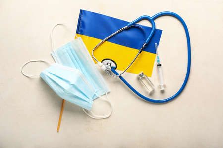 Doctor's supplies with flag of Ukraine on gray backgroundの写真素材