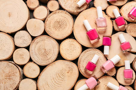 Bottles of nail polishes on wooden backgroundの写真素材