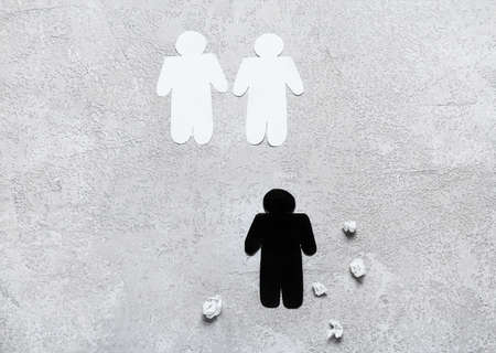 Paper human figures on light background. concept of racismの写真素材