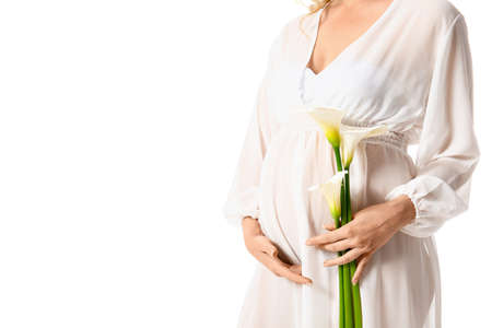 Young pregnant woman with calla lilies on white backgroundの写真素材