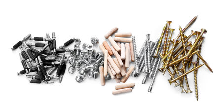 Furniture connectors, bolts, screws and dowels on white backgroundの写真素材