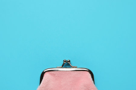 Pink wallet on blue backgroundの写真素材