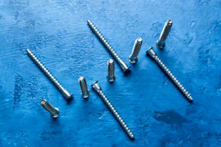 Set of tap bolts on blue backgroundの写真素材