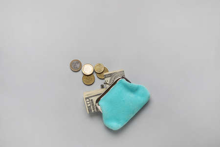 Blue wallet with money on gray backgroundの写真素材