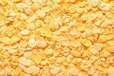 Tasty corn flakes as background, closeup
