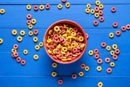 Bowl with cereal rings on wooden backgroundの写真素材