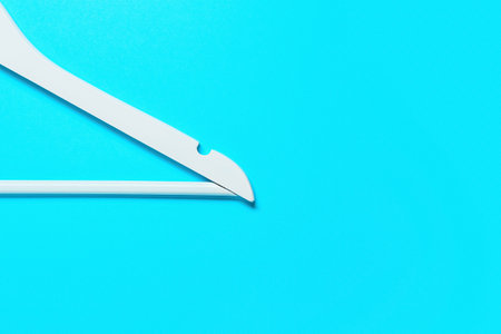 clothes hanger on blue backgroundの写真素材
