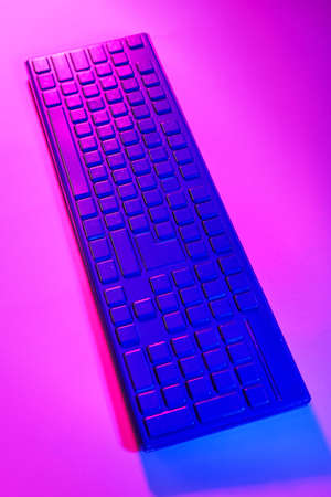 Modern computer keyboard on dark color backgroundの写真素材