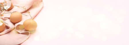 Easter eggs with napkin on pink background with space for text