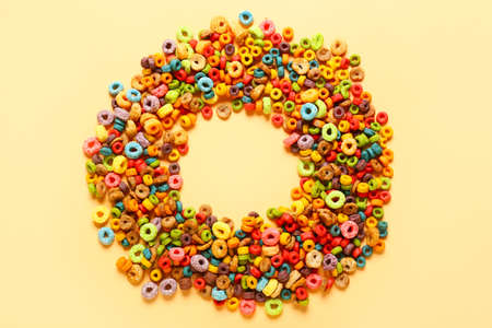 Frame made of tasty cereal rings on color backgroundの写真素材