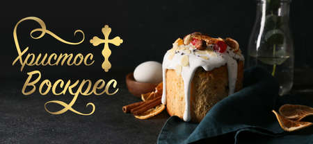 Beautiful greeting card for Easter celebration with tasty cakeの写真素材