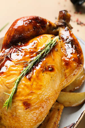 Plate with baked chicken and potato on color background, closeup