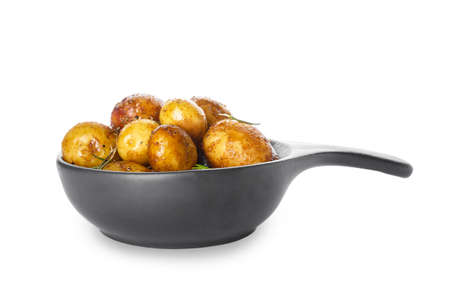 Frying pan with baked potatoes and rosemary on white backgroundの写真素材