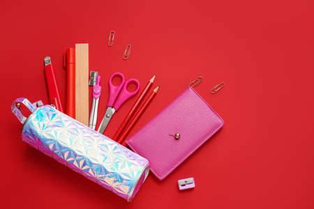 Pencil case and stationery on color backgroundの写真素材