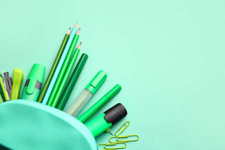 Pencil case and stationery on color backgroundの写真素材