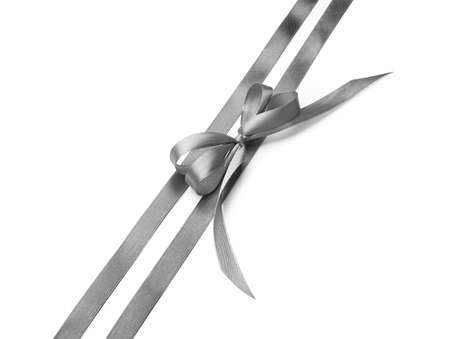 Beautiful silver bow with ribbons on white backgroundの写真素材