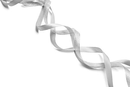Curly silver ribbons on white backgroundの写真素材
