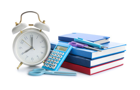 Set of stationery and alarm clock on white backgroundの写真素材